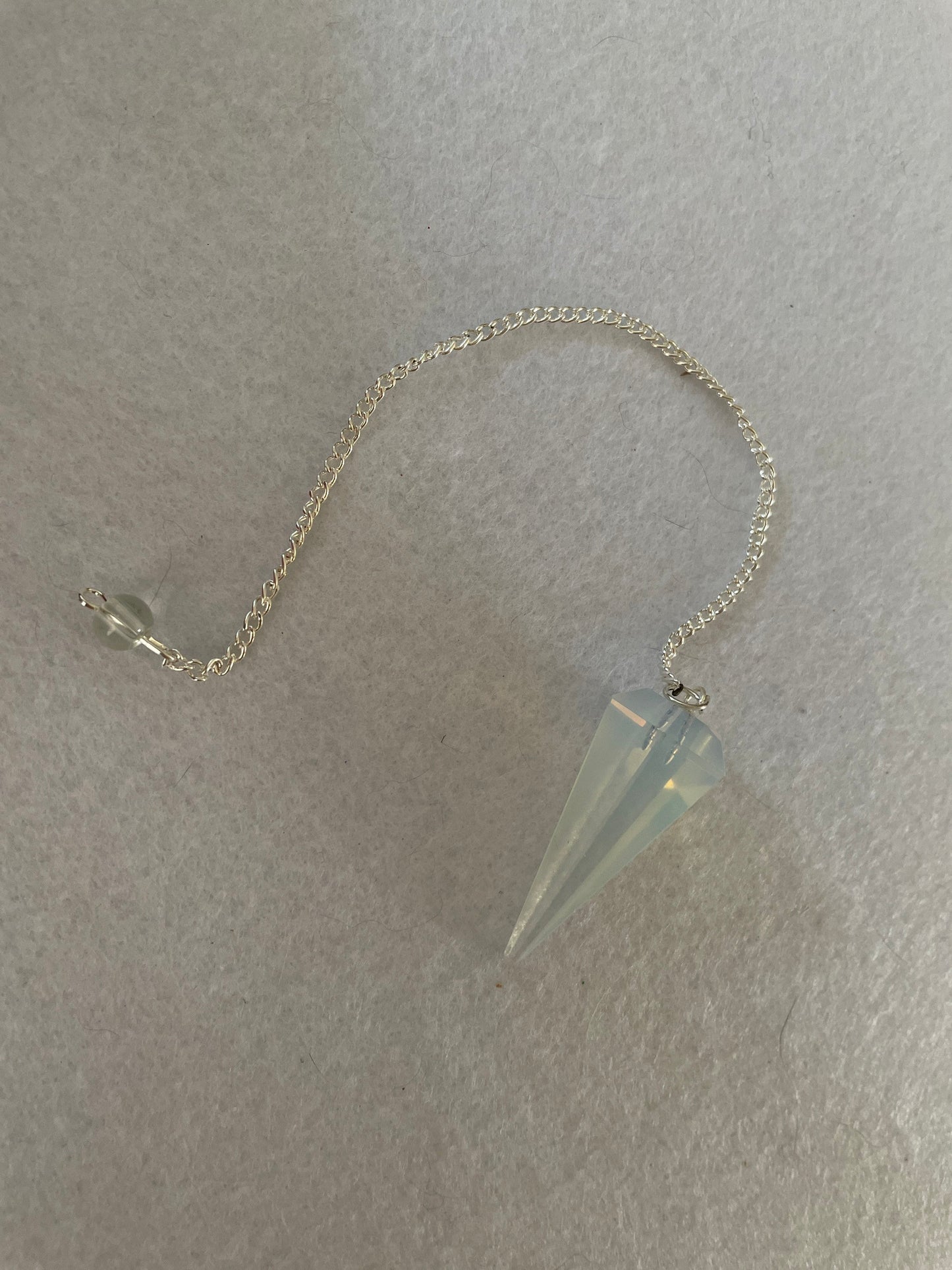 Gorgeous Opalite pendulum is approximately 1.65” and with chain is 8.5” total length