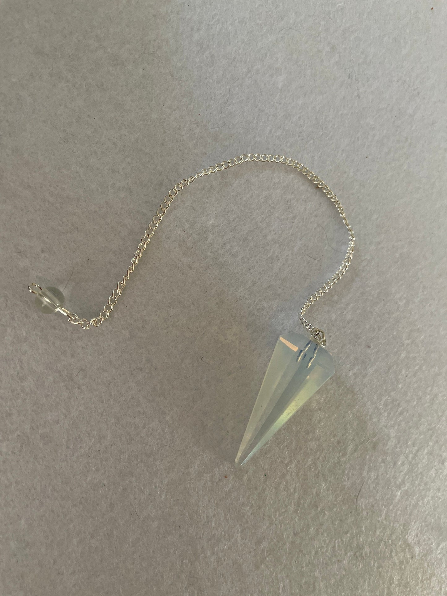 Gorgeous Opalite pendulum is approximately 1.65” and with chain is 8.5” total length