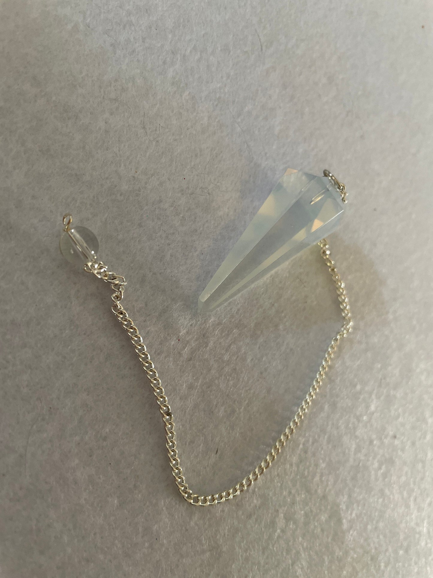 Nice Opalite pendulum is approximately 1.5” and with chain is 8.25” total length