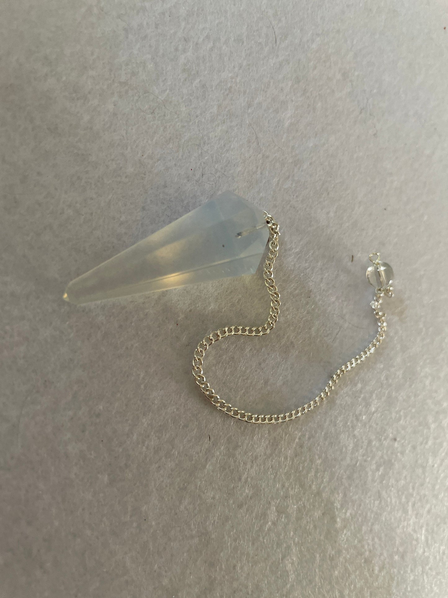 Nice Opalite pendulum is approximately 1.5” and with chain is 8.25” total length