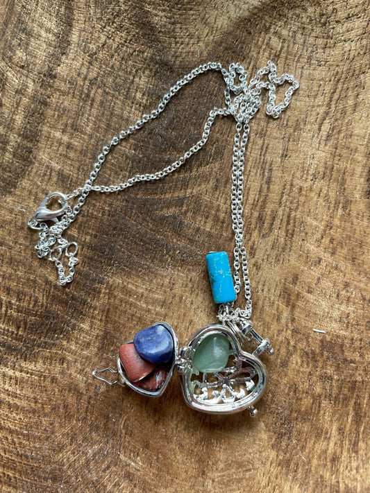 Beautiful Stainless steel silver chain locket filled with crystals With turquoise accent 16+”