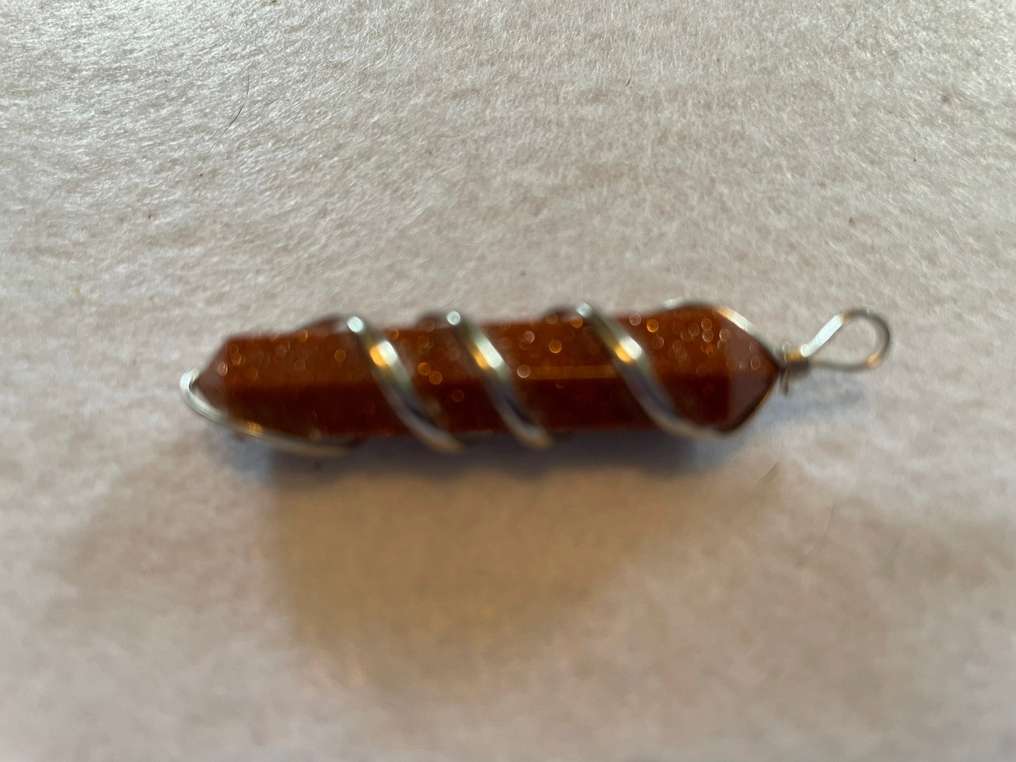 Gorgeous Goldstone Point Pendant is  1.5”