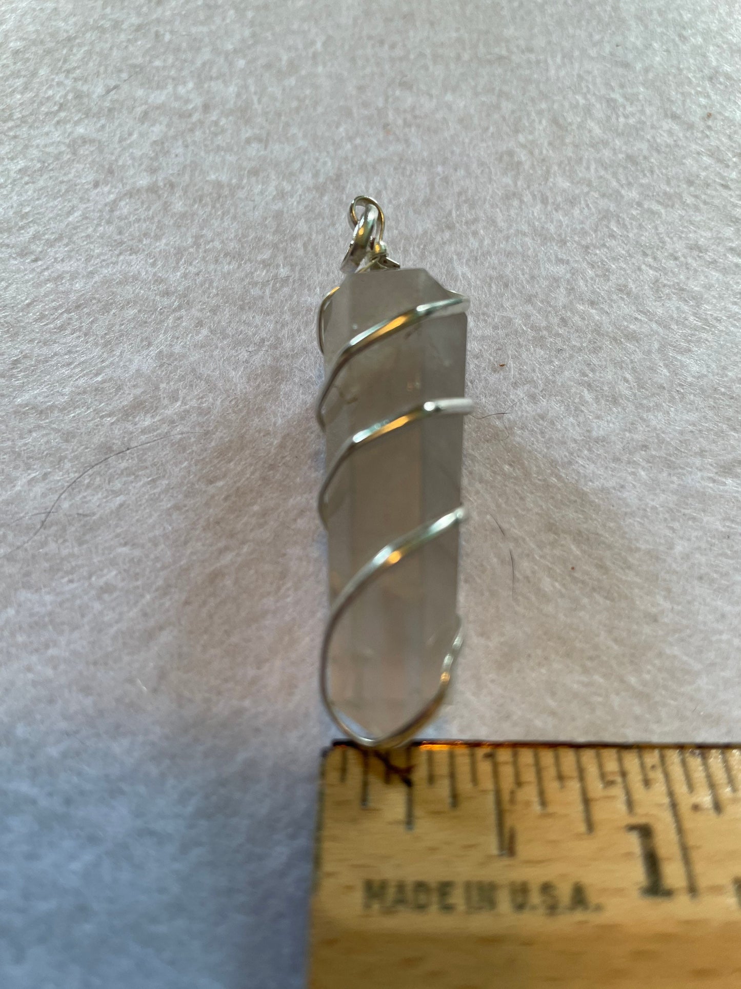 Beautiful Clear Quartz Point Pendant is  1.65” and is attached to precious silver making the total length 2”