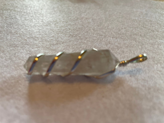 Beautiful Clear Quartz Point Pendant is  1.75” and is attached to precious silver making the total length 2.25”