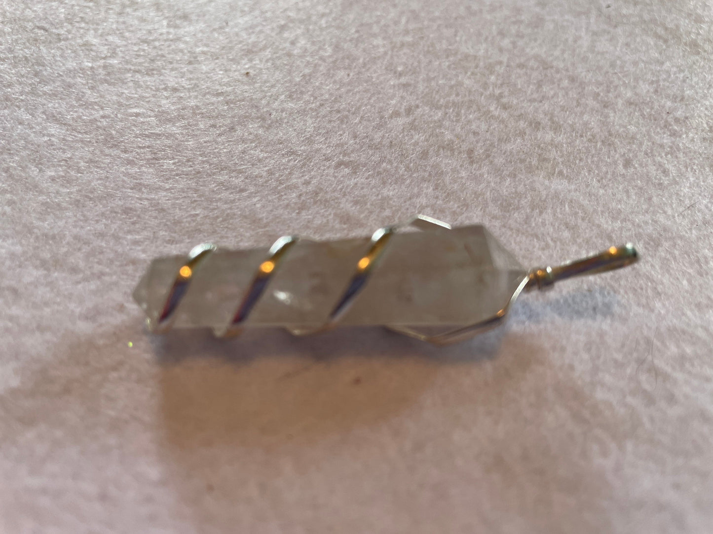 Beautiful Clear Quartz Point Pendant is  1.75” and is attached to precious silver making the total length 2.25”