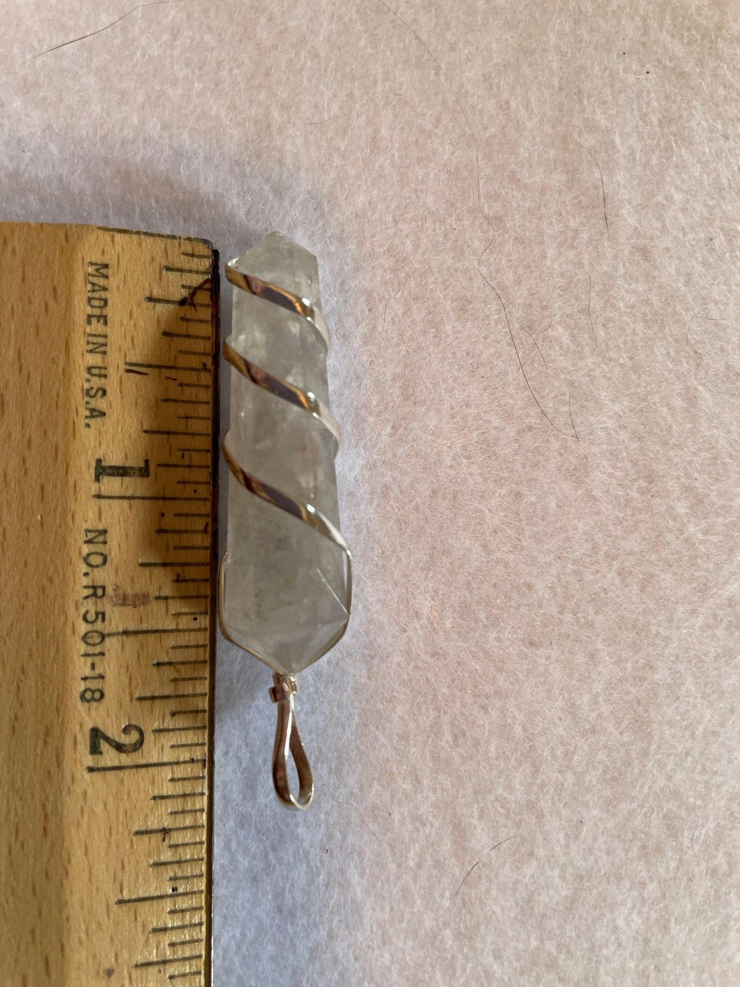 Beautiful Clear Quartz Point Pendant is  1.75” and is attached to precious silver making the total length 2.25”