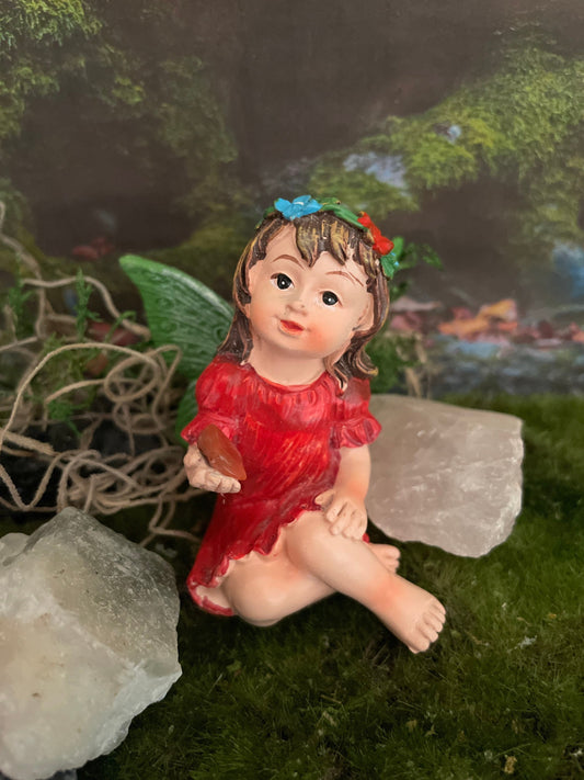 Look at her sweet face and she’s holding a carnelian crystal hand-painted fairy