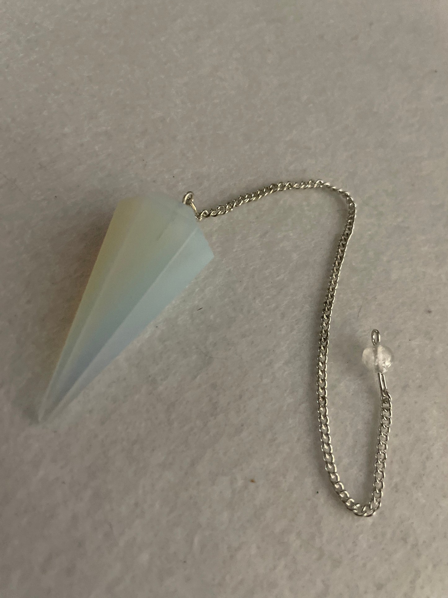 This beautiful Opalite Pendulum is  1.75” and with chain is 8.50”