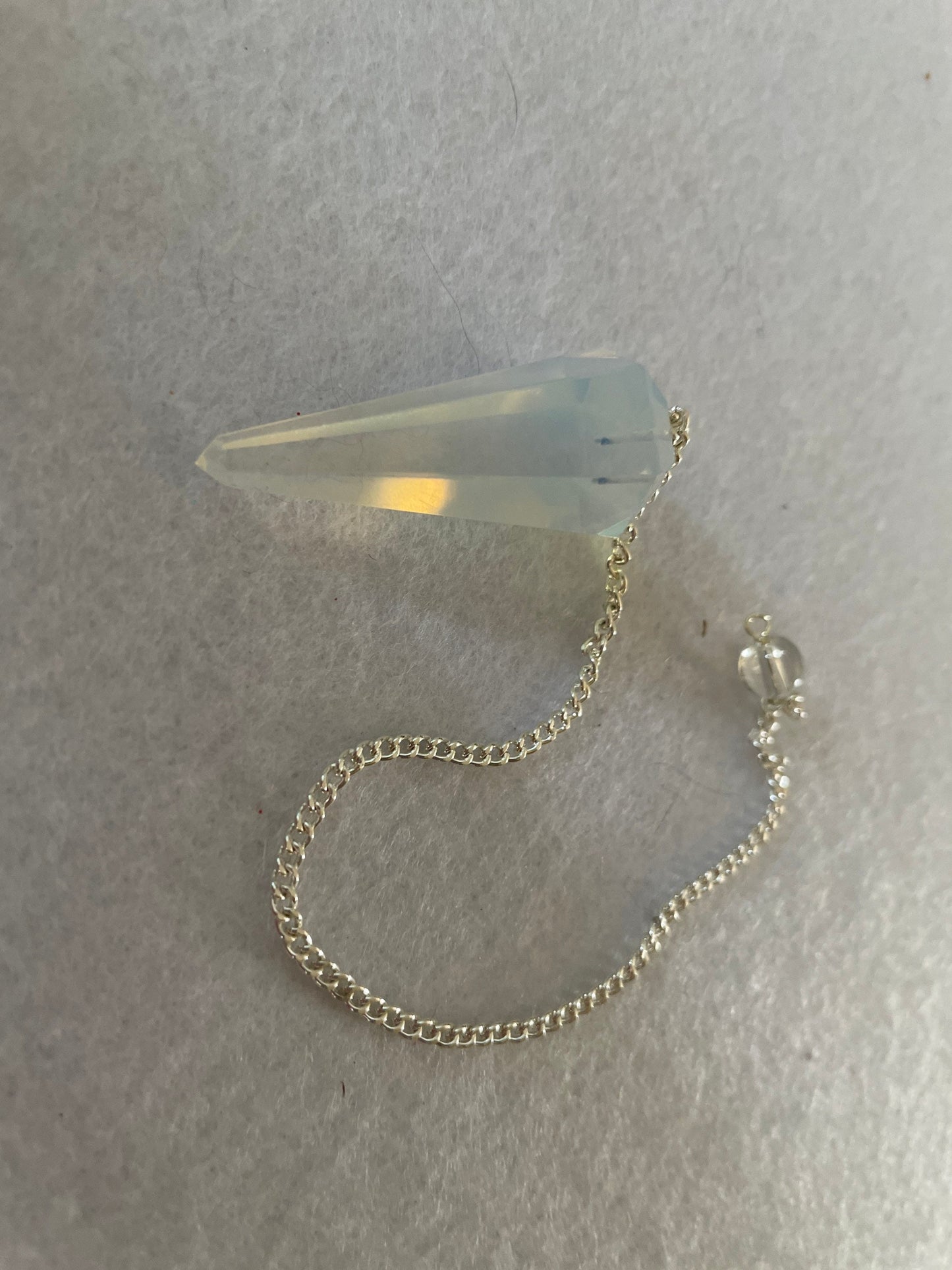 Nice Opalite pendulum is approximately 1.5” and with chain is 8.25” total length