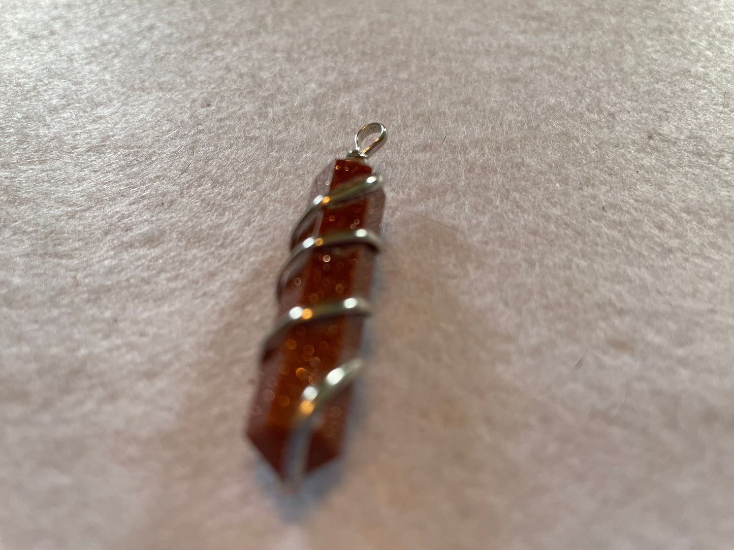 Gorgeous Goldstone Point Pendant is  1.5”