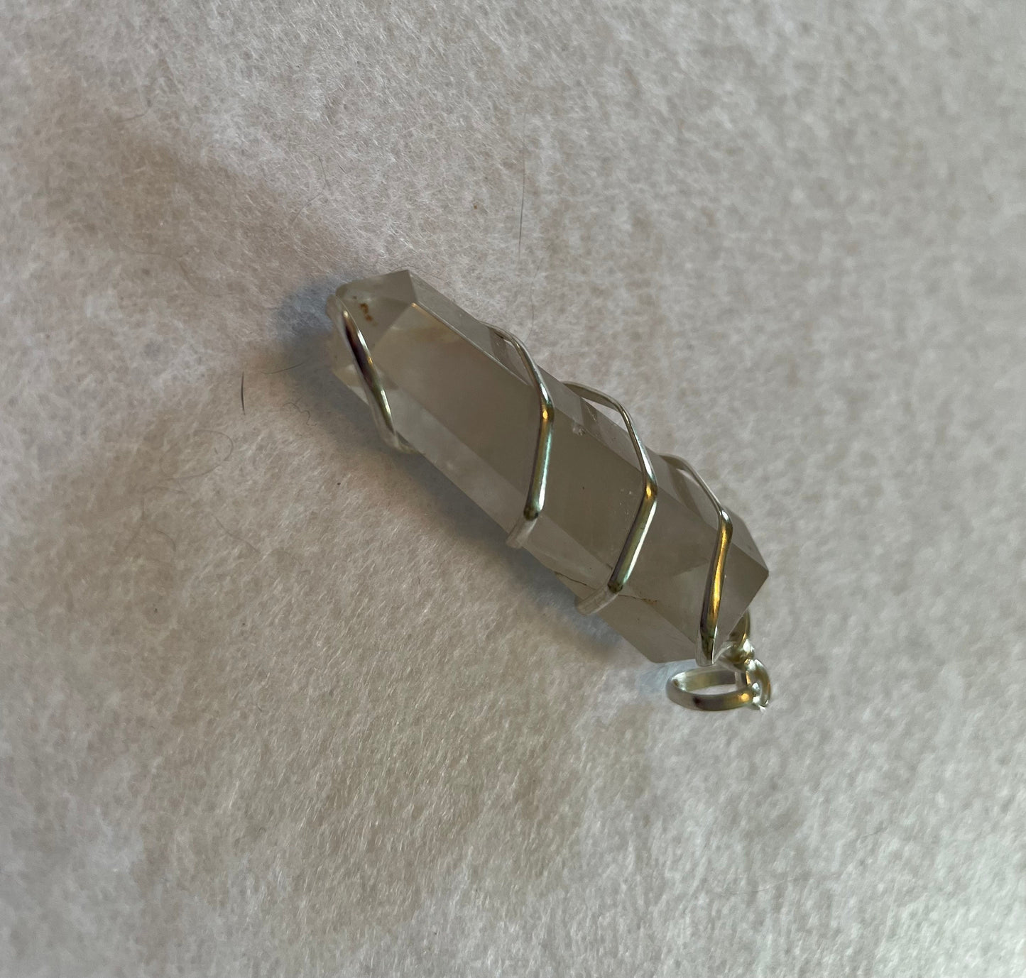 Beautiful Clear Quartz Point Pendant is  1.65” and is attached to precious silver making the total length 2”