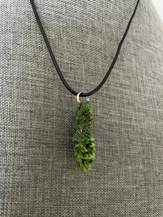 Greenman pendant necklace on black cord.