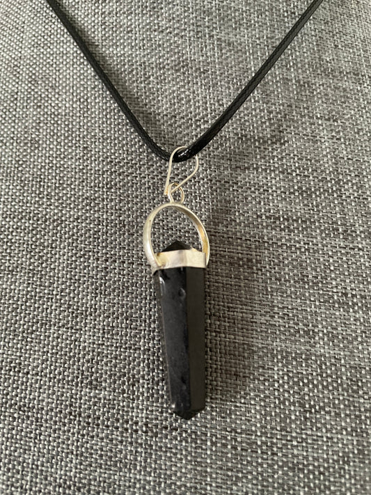 Beautiful black obsidian pendant on a black cord attached with silver wire