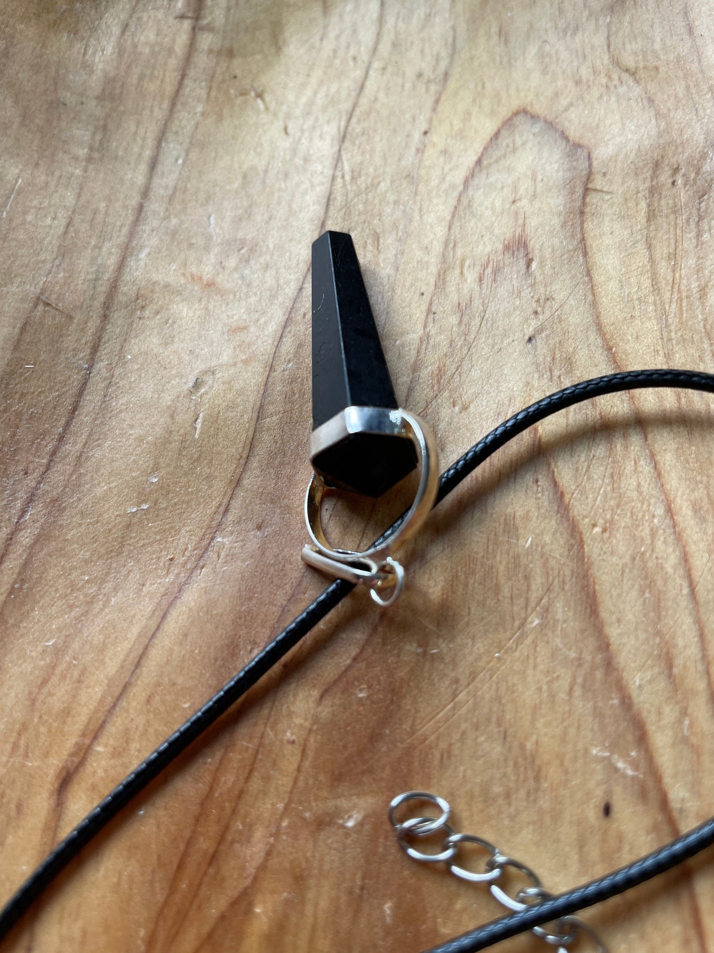 Super sharp looking black obsidian point necklace on black cord