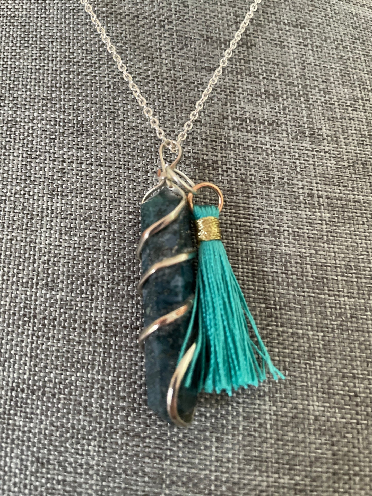 Gorgeous Moss Agate double Point Pendant with pretty teal Pom is 1.5” and is attached to precious silver making the total length almost 2”