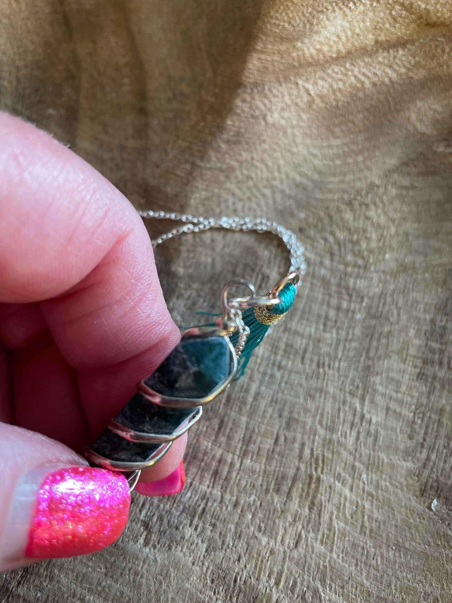 Gorgeous Moss Agate double Point Pendant with pretty teal Pom is 1.5” and is attached to precious silver making the total length almost 2”