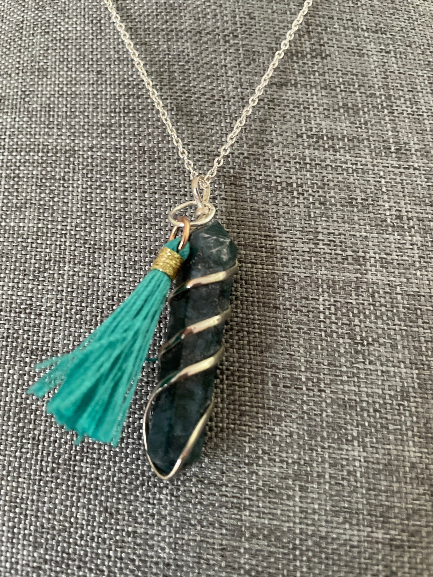 Gorgeous Moss Agate double Point Pendant with pretty teal Pom is 1.5” and is attached to precious silver making the total length almost 2”