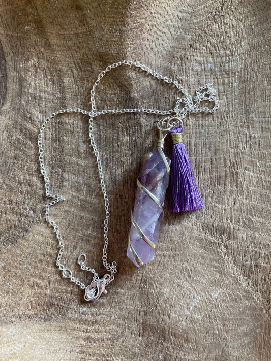 Gorgeous Banded Amethyst double Point Pendant is  2” and is attached to precious silver making the total length almost 2.25” with purple Pom