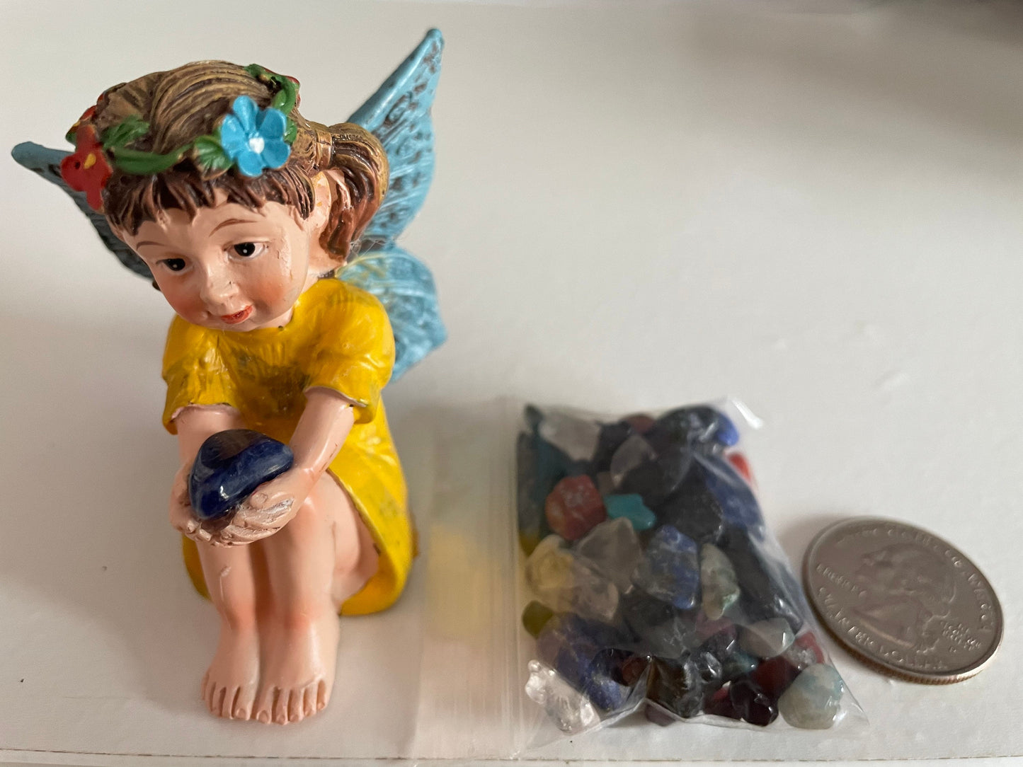 Look at her sweet face and she’s holding a Sodalite crystal hand-painted fairy with crystals