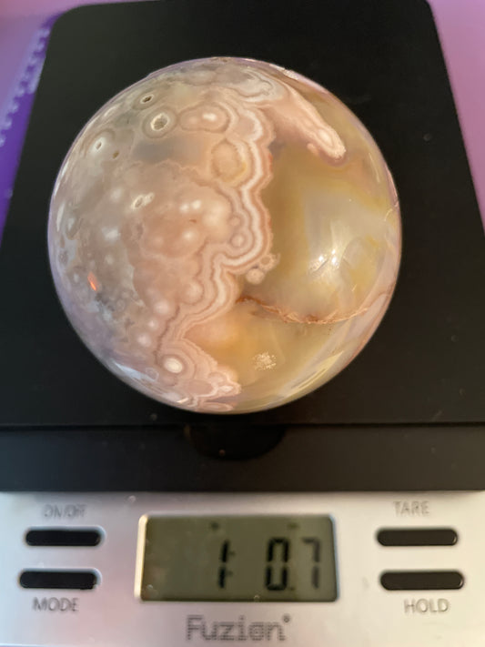 Flower Agate Sphere weighs just over 1 pound